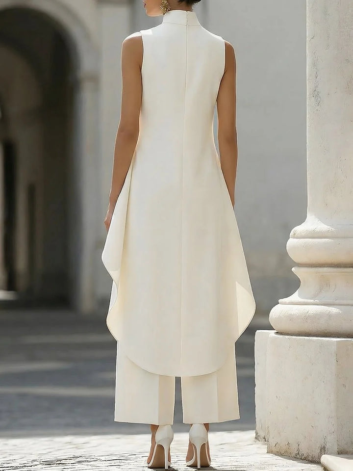 Women's two piece set featuring an asymmetrical high neck top and wide-leg trousers, designed for an elegant and modern look, perfect for any occasion. 3