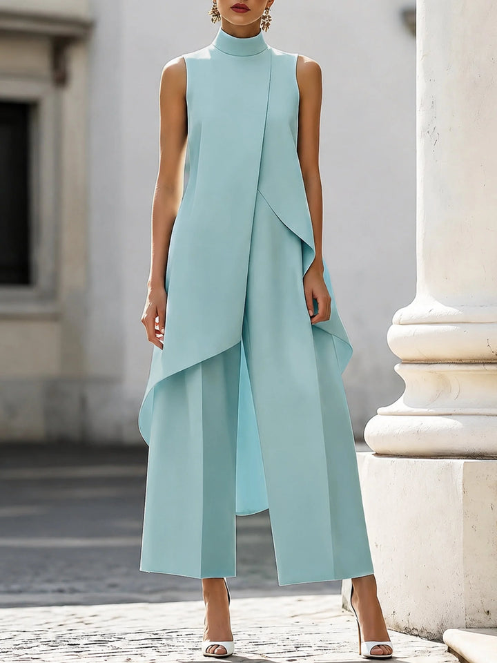 Women's two piece set featuring an asymmetrical high neck top and wide-leg trousers, designed for an elegant and modern look, perfect for any occasion. 6