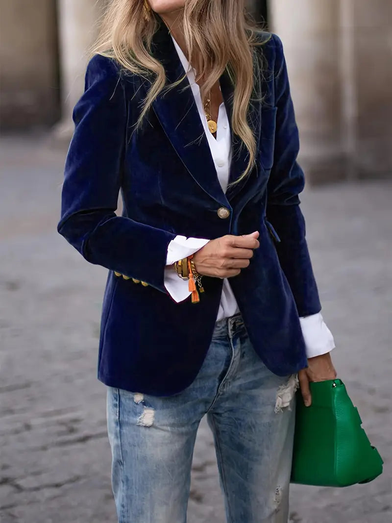 Women's black velvet blazer featuring a tailored design, ideal for versatile styling and elegant occasions. 5