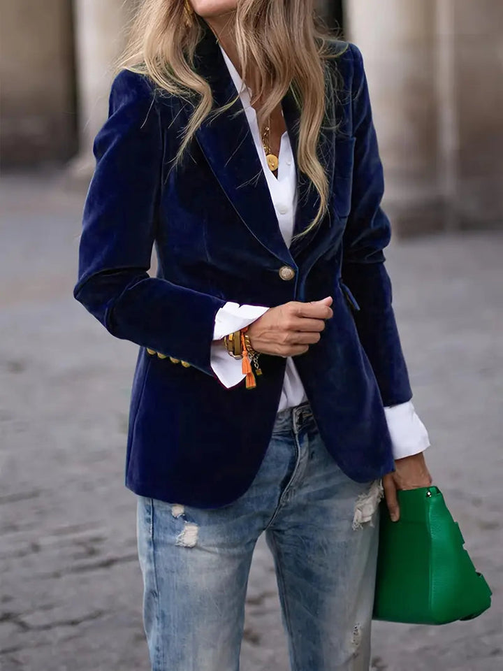Women's black velvet blazer featuring a tailored design, ideal for versatile styling and elegant occasions. 5