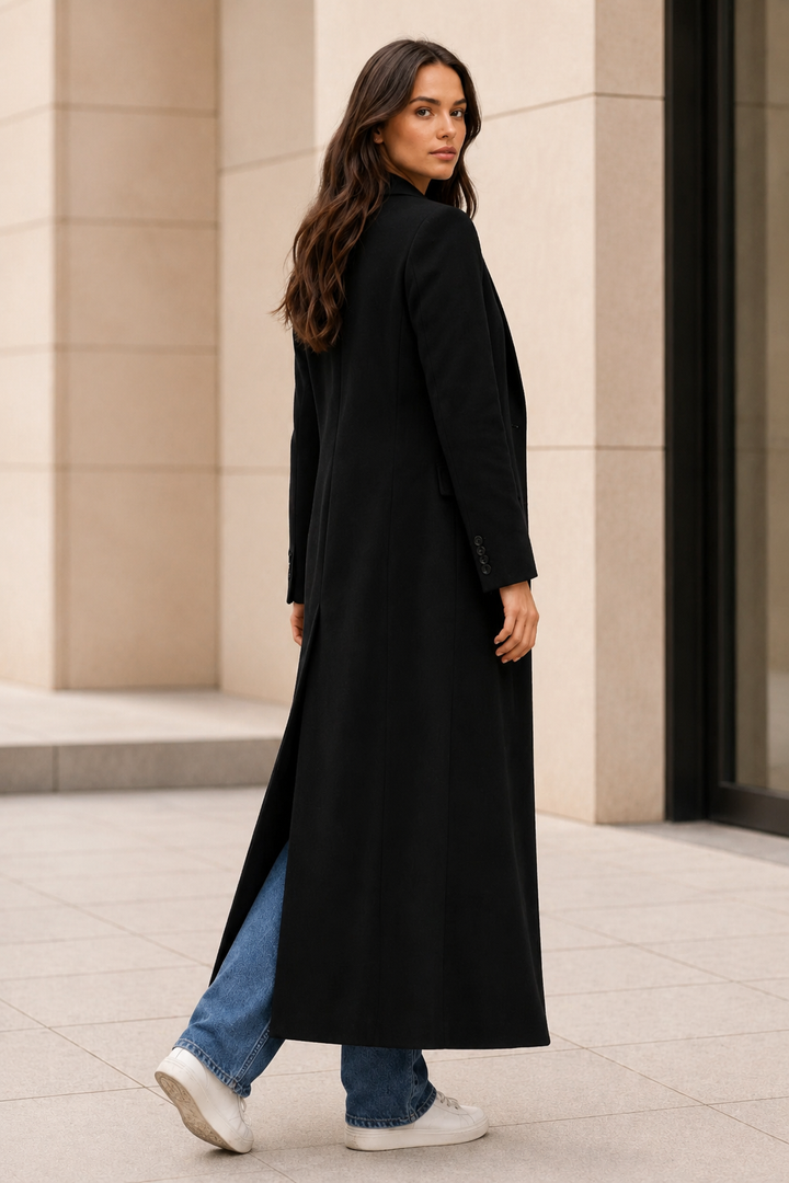 Women's winter coat featuring a tailored silhouette, designed for a minimalist look, with a long maxi style perfect for cold weather. 2