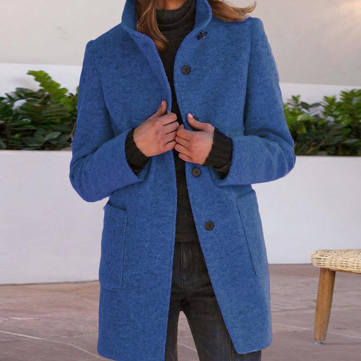 Women's wool coat featuring a tailored fit and stylish button closure, perfect for elegant winter outerwear. 1