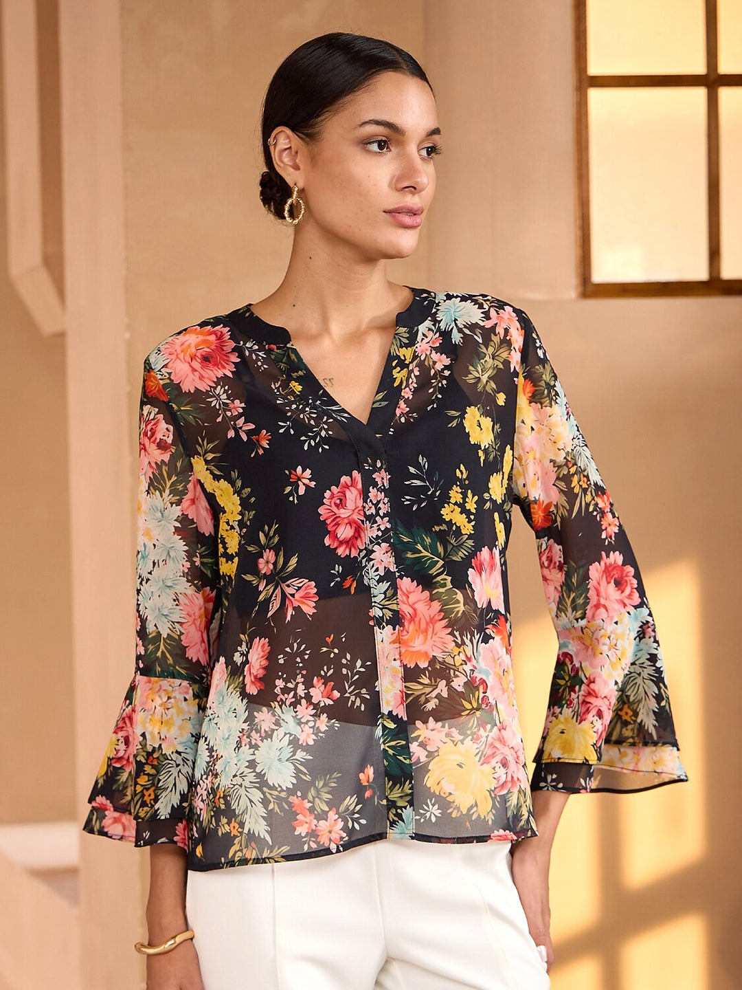 Womens blouse featuring a V-neck and ruffle sleeves, made from flowy chiffon with a Moonlight Blossom floral design, perfect for summer wear. 0