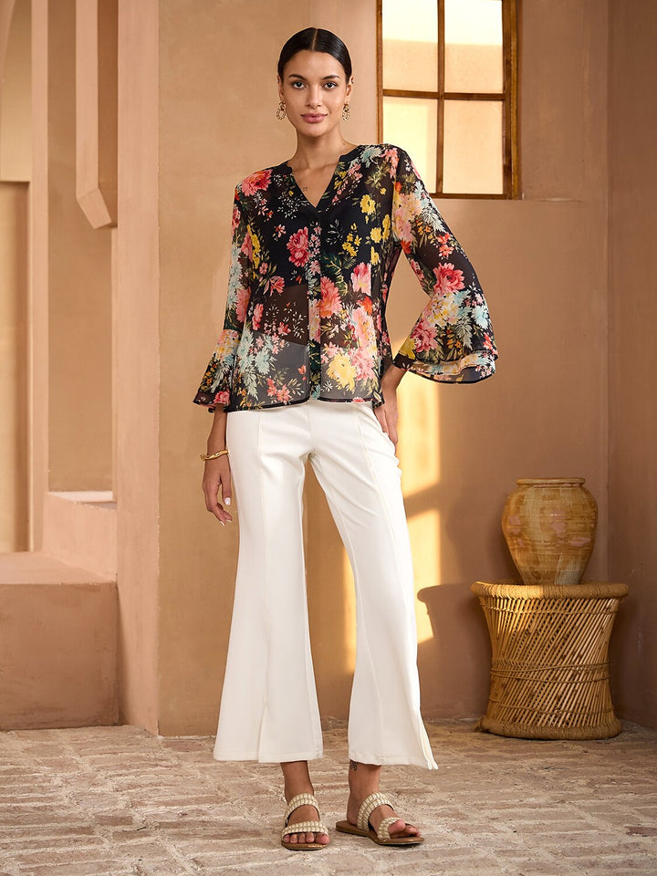 Womens blouse featuring a V-neck and ruffle sleeves, made from flowy chiffon with a Moonlight Blossom floral design, perfect for summer wear. 1
