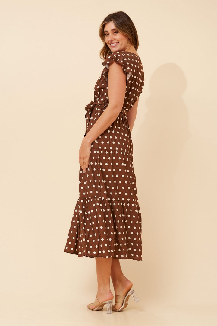 Womens polka dot midi dress featuring a crossover neckline and frill sleeves, designed for a relaxed fit, perfect for wedding guests and summer events. 4