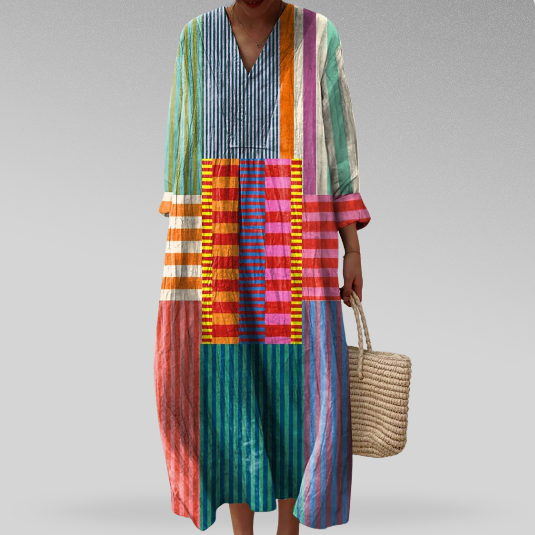 Womens dress featuring a flowing silhouette and geometric pattern, designed for stylish and comfortable day or night wear. 0