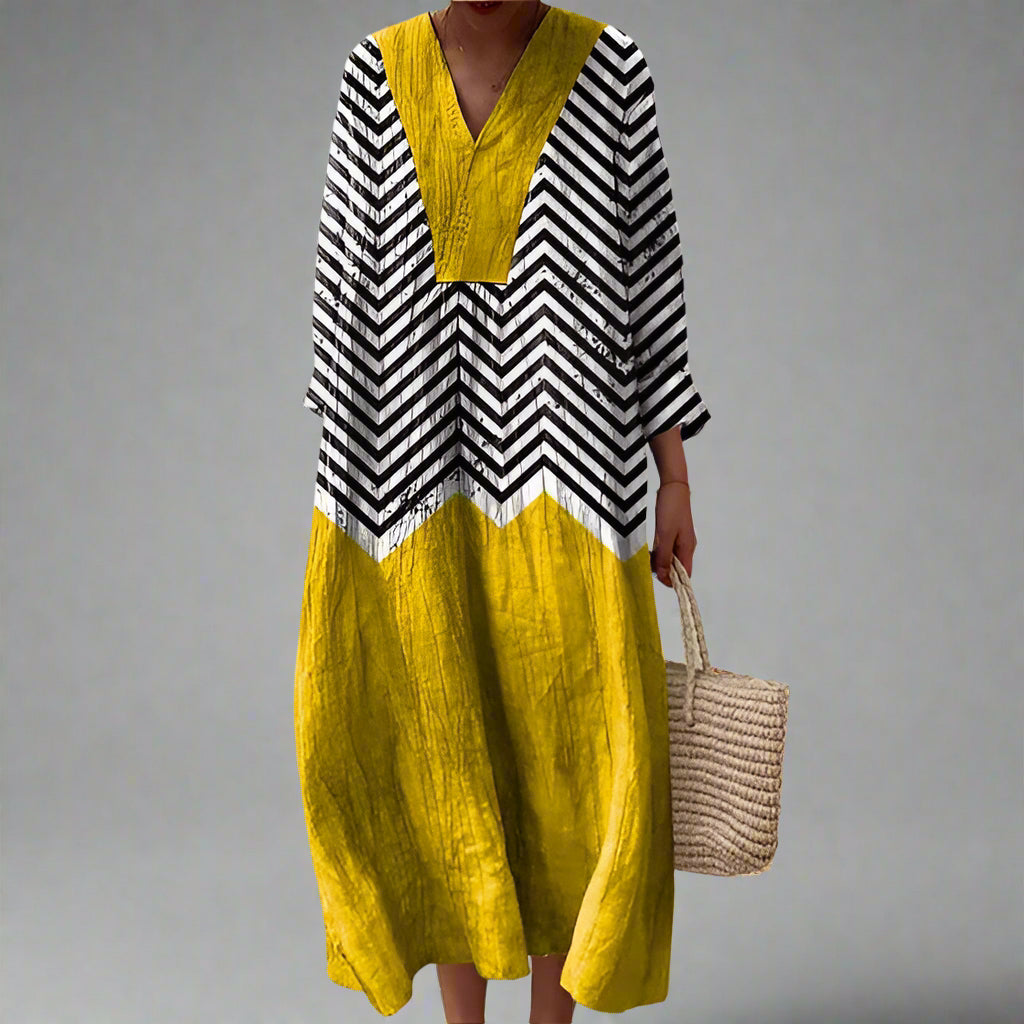 Womens dress featuring a flowing silhouette and geometric design, perfect for both formal and everyday occasions. 0