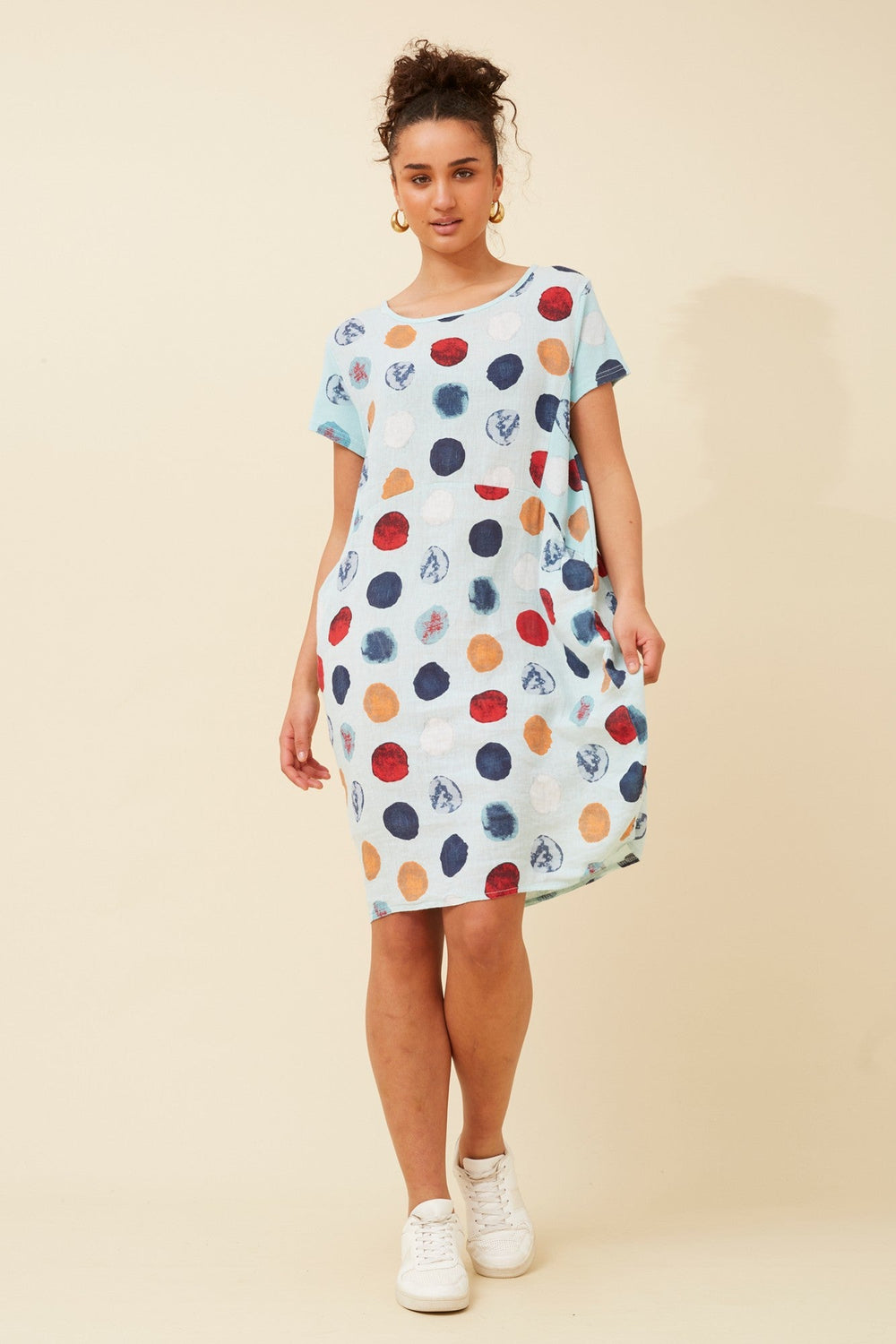 Women's knee-length polka dot linen summer dress with short sleeves and side pockets, featuring a relaxed fit for comfort and style. 1