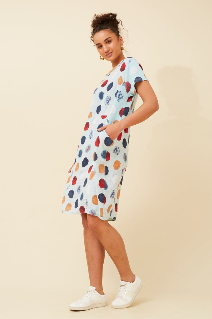 Women's knee-length polka dot linen summer dress with short sleeves and side pockets, featuring a relaxed fit for comfort and style. 3