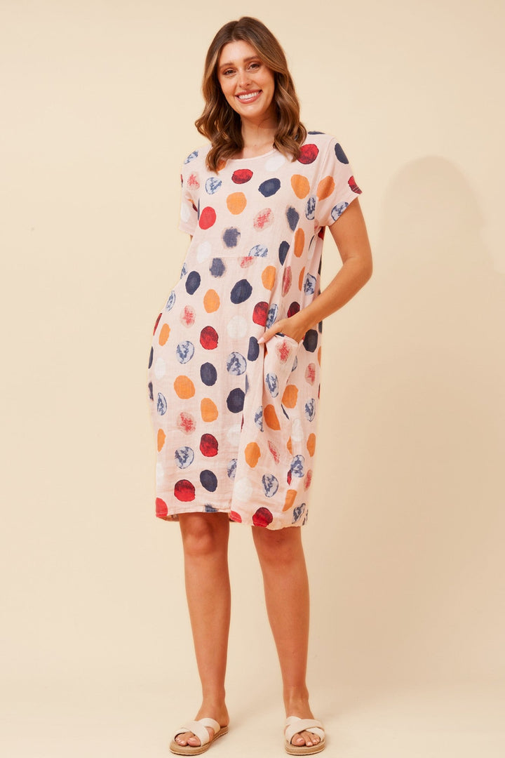 Women's knee-length polka dot linen summer dress with short sleeves and side pockets, featuring a relaxed fit for comfort and style. 9