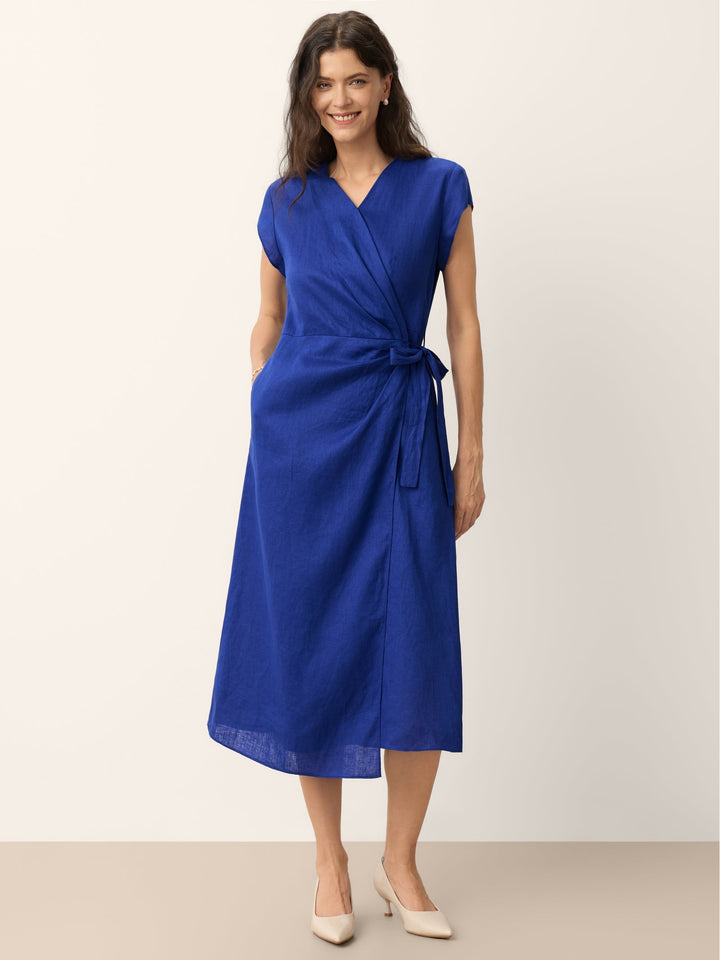 Womens linen midi wedding guest dress in cobalt blue featuring a wrap-tie waist and stylish cap sleeves. 0
