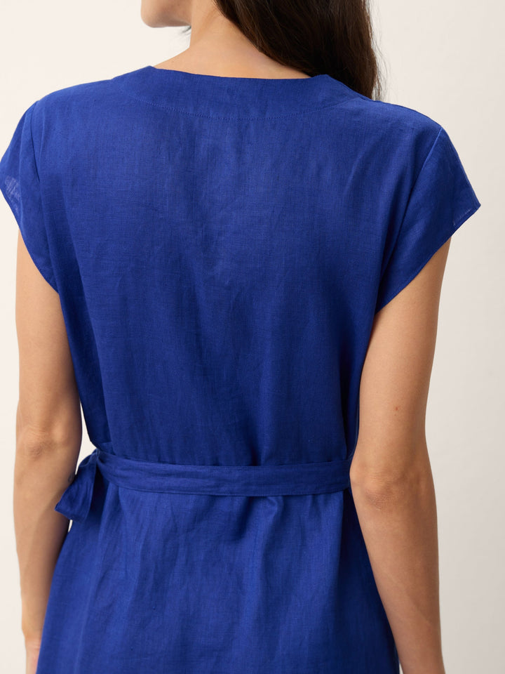 Womens linen midi wedding guest dress in cobalt blue featuring a wrap-tie waist and stylish cap sleeves. 7