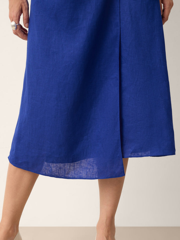 Womens linen midi wedding guest dress in cobalt blue featuring a wrap-tie waist and stylish cap sleeves. 8