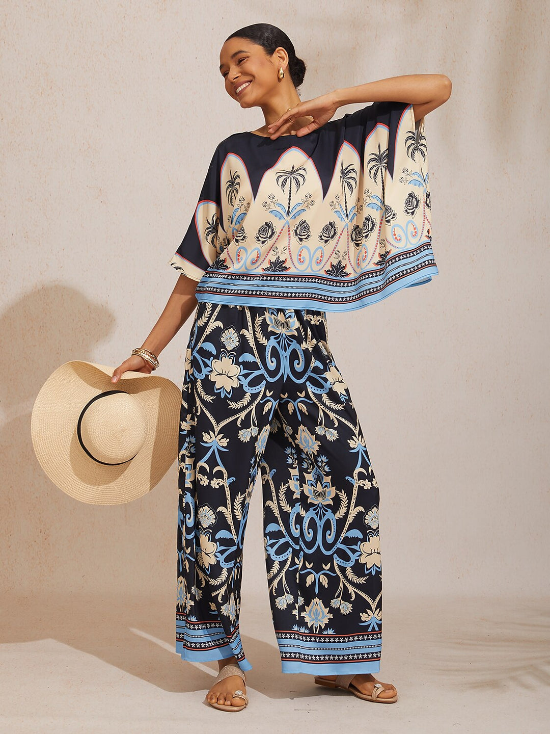 Womens top featuring an asymmetric hem and batwing sleeves in an abstract floral satin design, perfect for stylish and comfortable everyday wear. 10