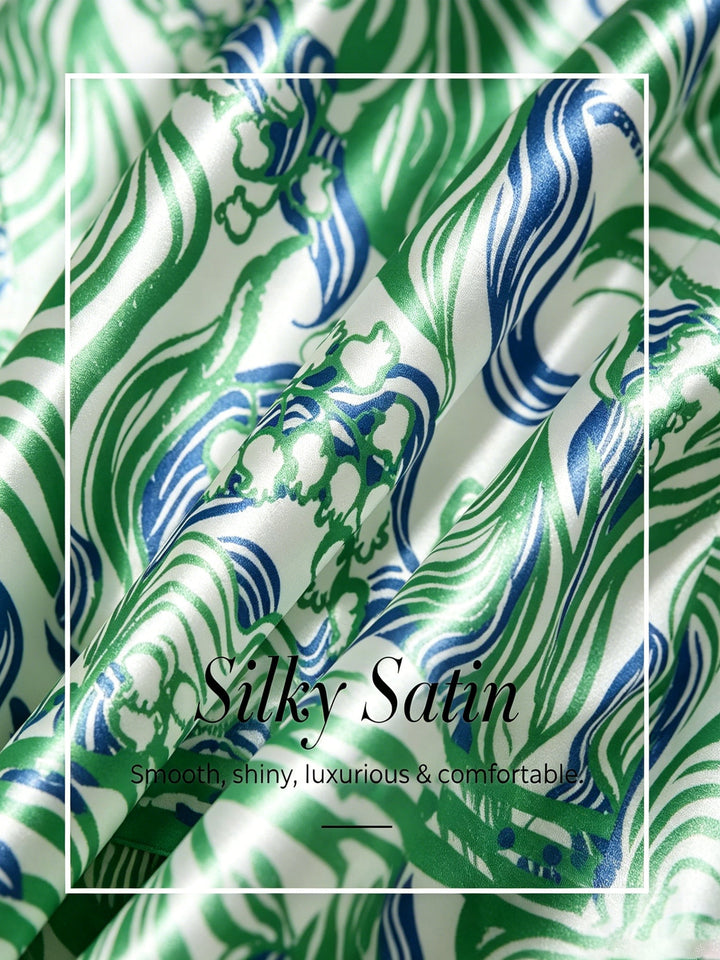 Womens top featuring an asymmetric hem and batwing sleeves in an abstract floral satin design, perfect for stylish and comfortable everyday wear. 3