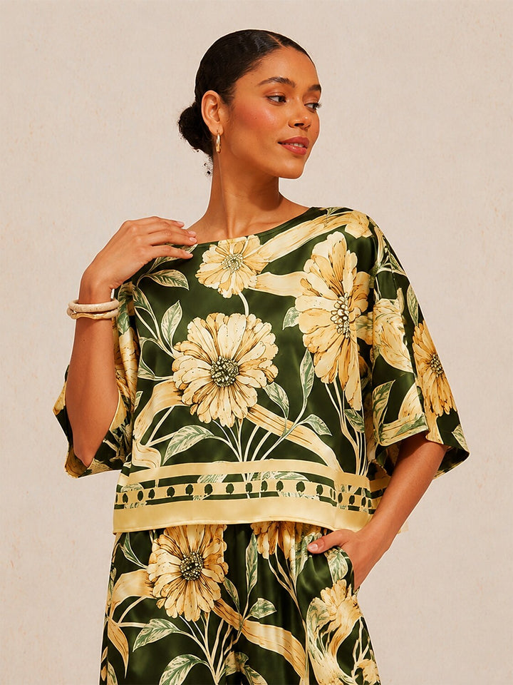 Womens floral satin top in cream yellow featuring an asymmetrical hem and stylish kimono sleeves, perfect for a night out. 1