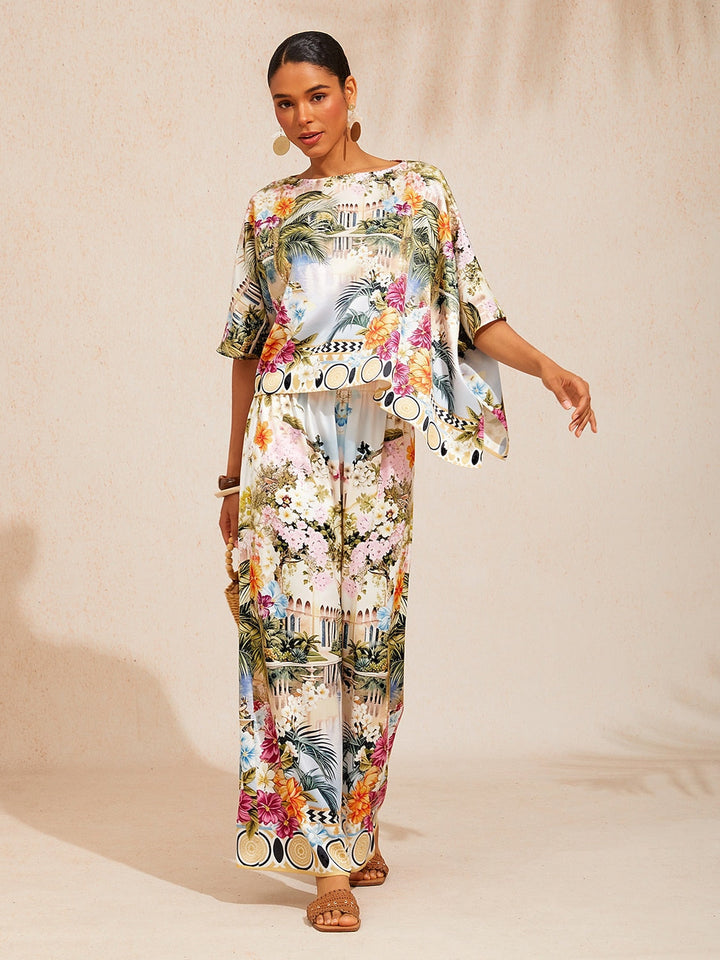 Womens floral satin top in cream yellow featuring an asymmetrical hem and stylish kimono sleeves, perfect for a night out. 11