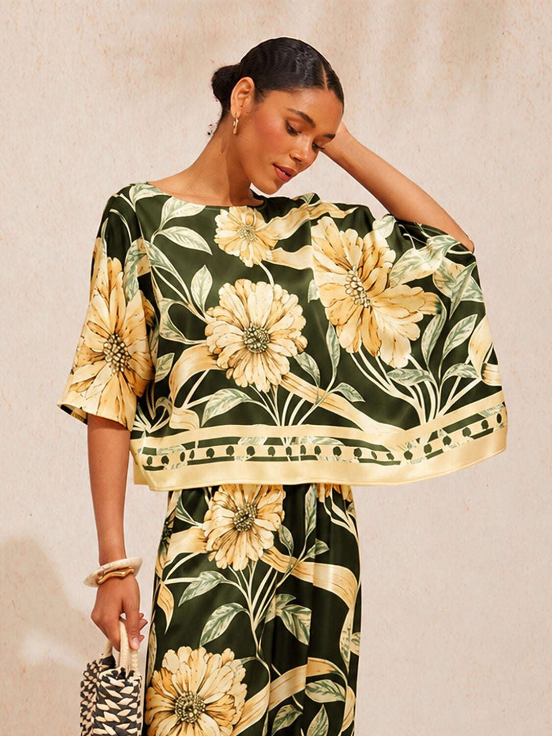 Womens floral satin top in cream yellow featuring an asymmetrical hem and stylish kimono sleeves, perfect for a night out. 3