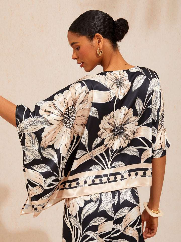 Womens top featuring an asymmetrical hem and kimono sleeves, crafted from silky satin with a golden petal print, perfect for a stylish night out 1