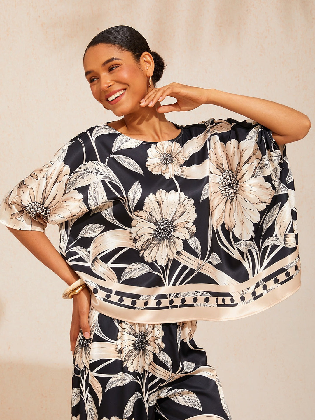Womens top featuring an asymmetrical hem and kimono sleeves, crafted from silky satin with a golden petal print, perfect for a stylish night out 2