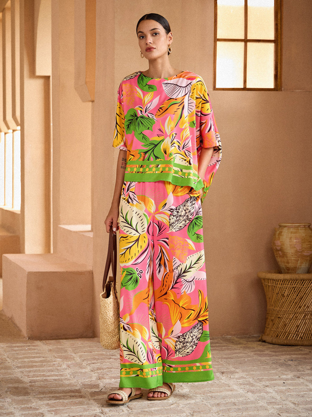 Womens top featuring an asymmetrical hem and kimono sleeves, made of silky satin with a vibrant tropical print, perfect for stylish summer outfits. 4
