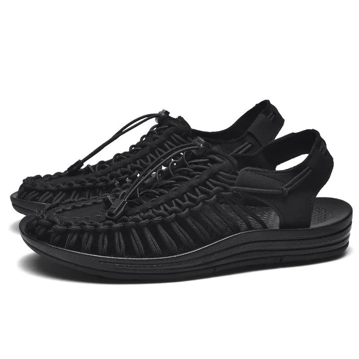 Woven beach sandals featuring a breathable design and lightweight flat sole, perfect for casual outdoor beachwear. 0