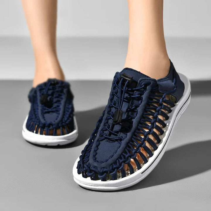 Woven beach sandals featuring a breathable handcrafted design and a lightweight flat sole, perfect for casual outdoor comfort. 5